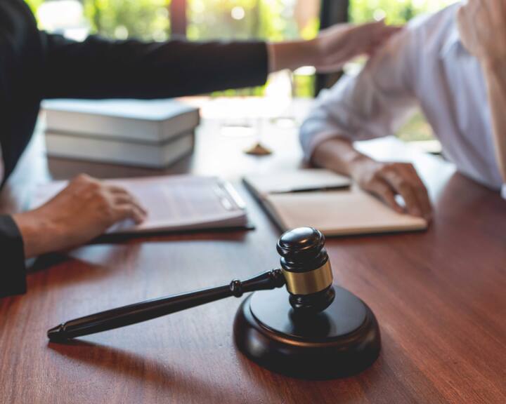 professional lawyer discussing legal options and solutions with a client in Winston Salem
